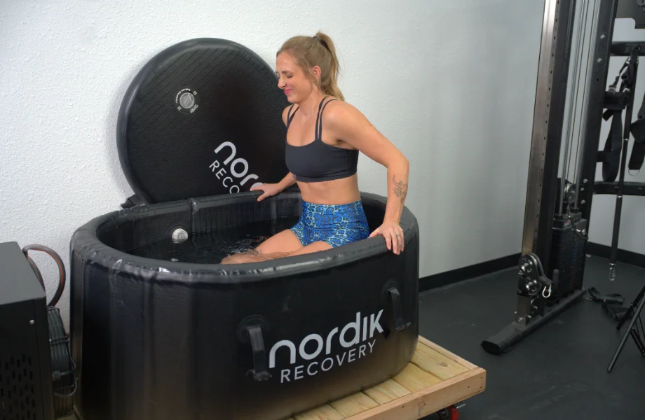 Our tester getting out of the Nordik Recovery Cold Tub