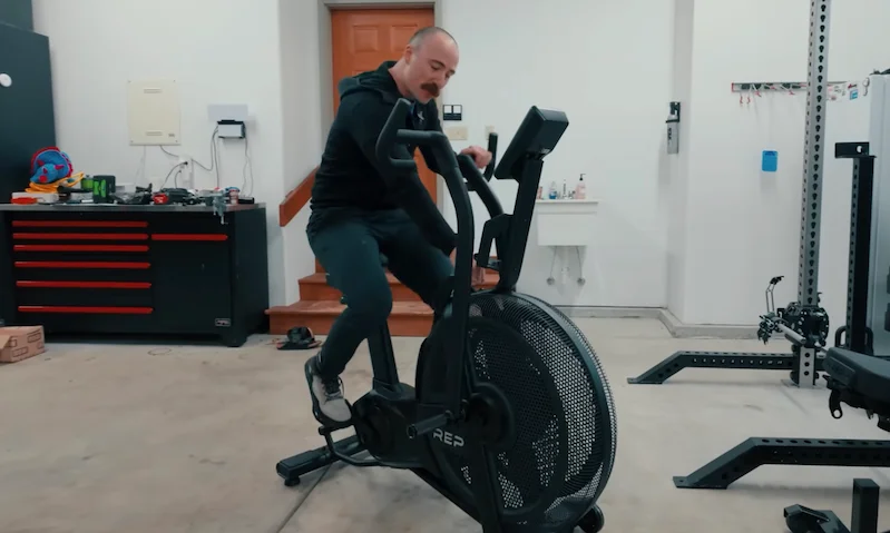 Coop riding the REP Strive Air Bike