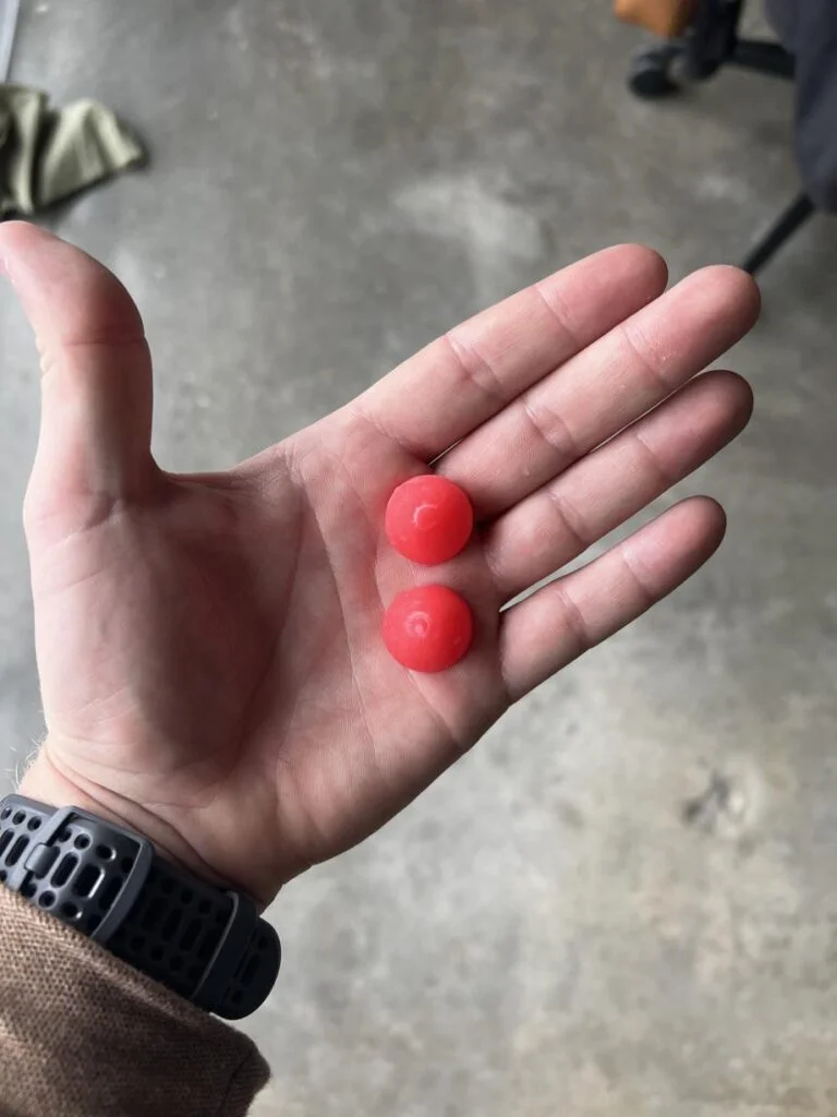 A hand holding Organifi Creatine Chews
