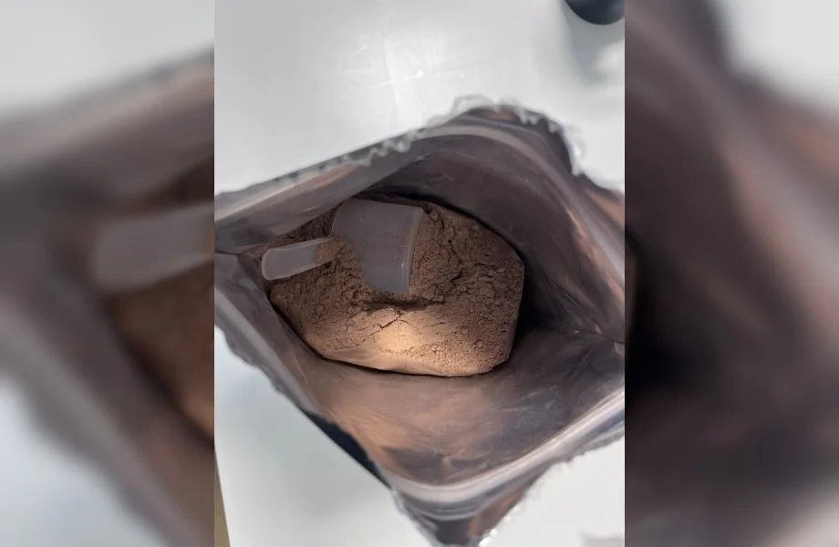 Looking down into a bag of Sports Research Whey Protein Isolate.