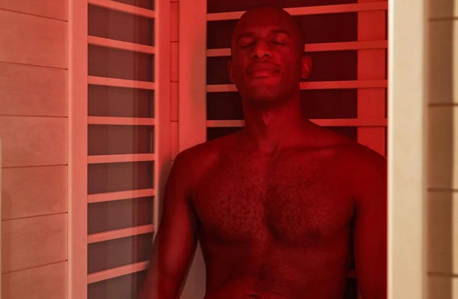 A man sitting in the Sunlighten Amplify II sauna.
