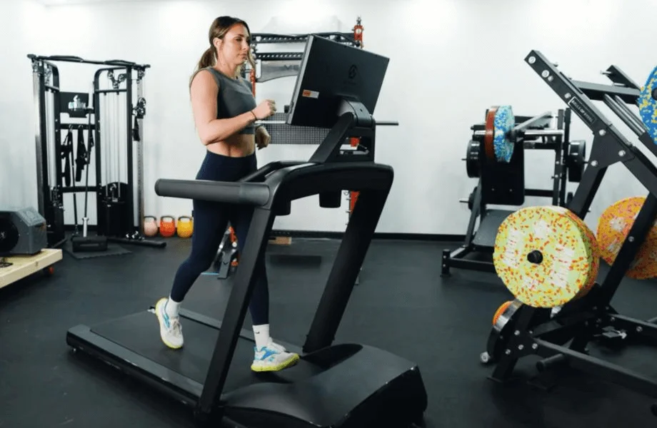 Our tester jogging on the Aviron Victory Treadmill in the GGR testing center