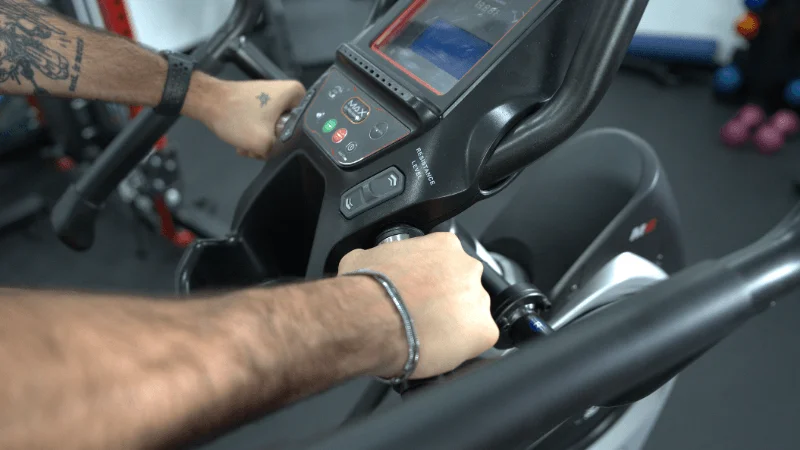 The center cupholder and pulse sensors found on the Bowflex Max Trainer M6