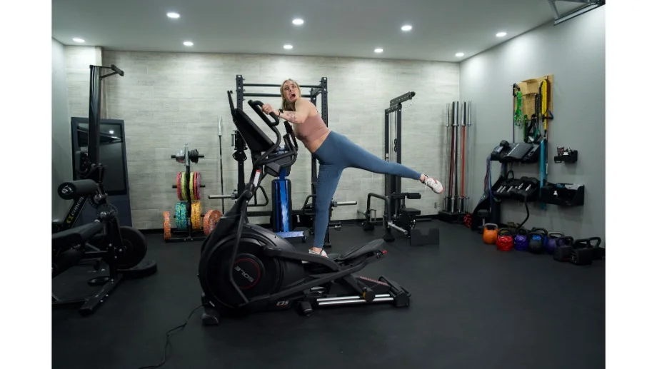 sole e35 elliptical full view standing on elliptical with one leg