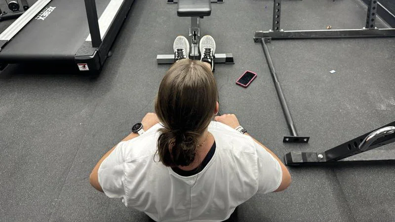 Our tester doing low rows with the GDLF Lat Pulldown Machine