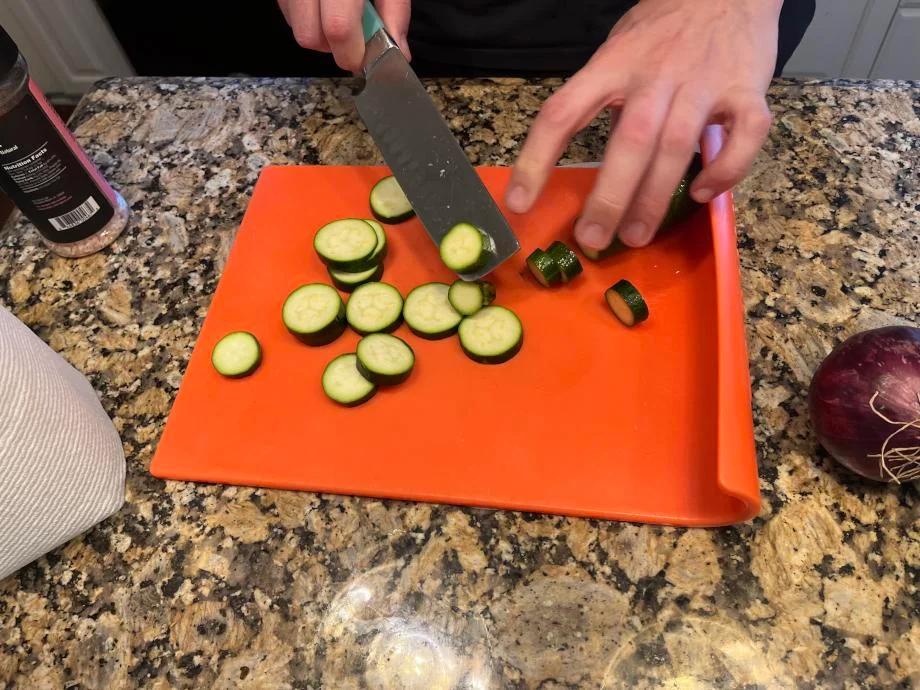 Our tester chops zucchini from Martha and Marley Spoon