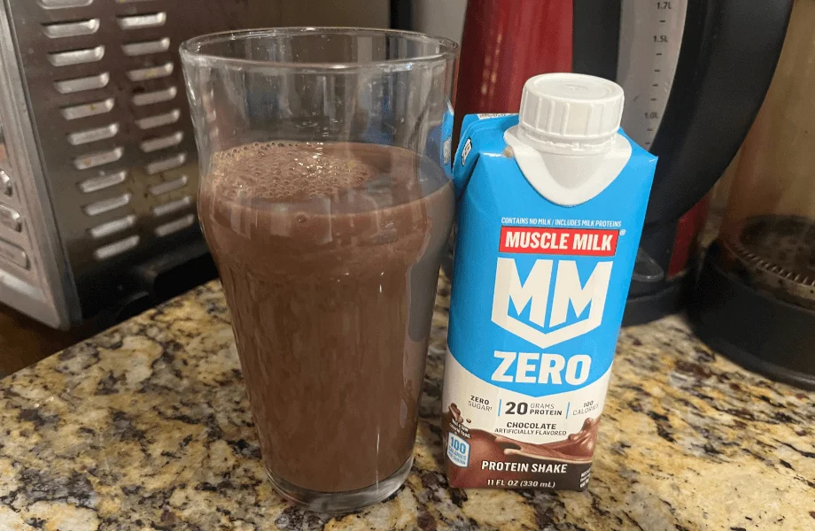 A single Muscle Milk Zero Protein Shake, poured into a standard pint glass