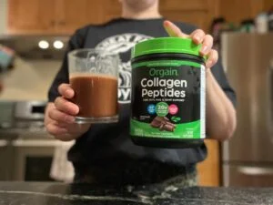 orgain collagen woman holding glass of collagen