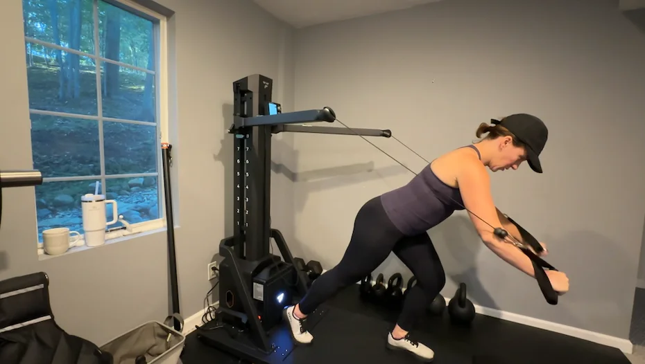 Woman doing a cable chest press on FitTransformer Titan