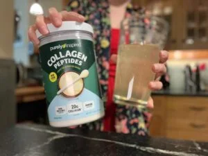 purely inspired collagen person holding container and glass