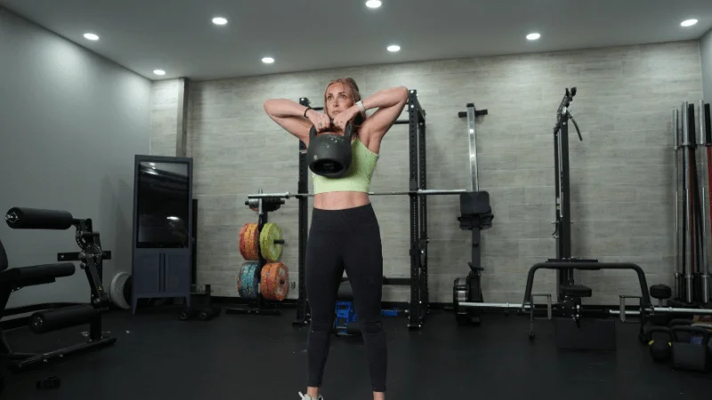 Our tester rowing the REP Fitness Adjustable Kettlebell to chest height