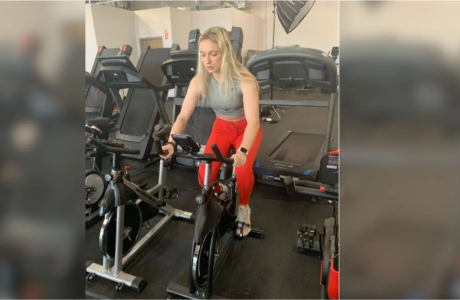 woman riding exercise bike