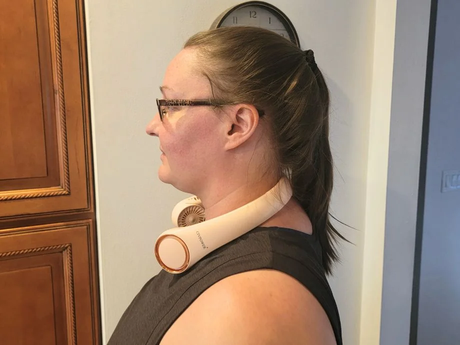 An image from the side of a woman wearing the CIVPOWER neck fan