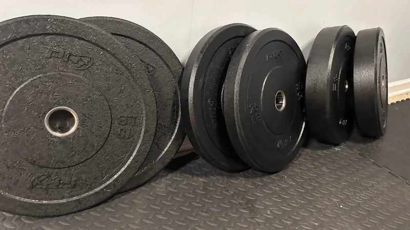 An assortment of PRx Crumb Rubber Bumper Plates in our tester's home gym