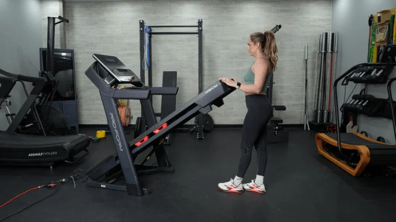 Our tester lowering the running deck on the ProForm Carbon TLX treadmill