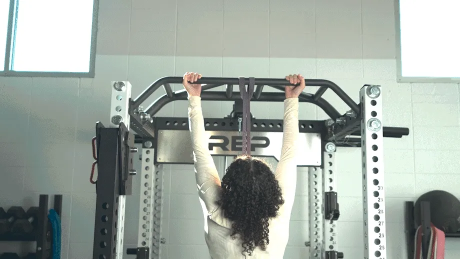 woman performing a banded chin up