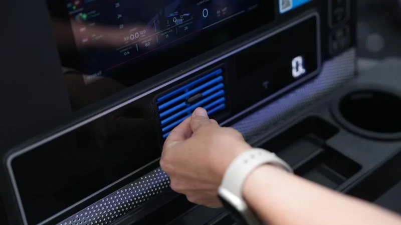 A person adjusts the fan vent on an Echelon Stride 6s-10 treadmill.