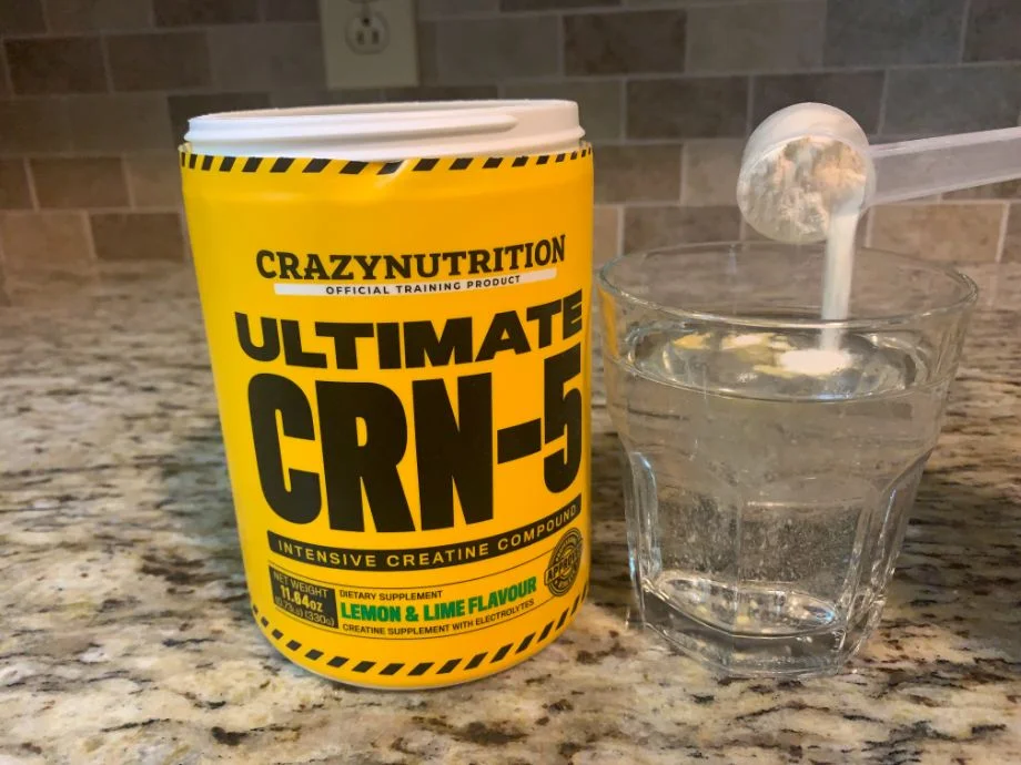 scooping CRN-5 into glass of water