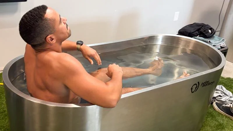 Our submerged tester braces against the icy water in a Polar Monkeys Cyber Tub