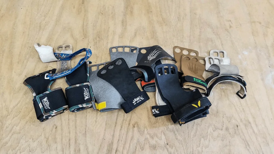 Several gymnastics grips in a pile on the floor