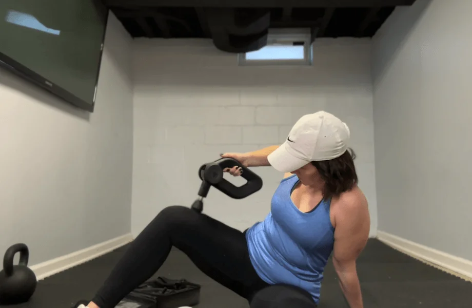 Our tester using the Bob and Brad D6 Pro massage gun