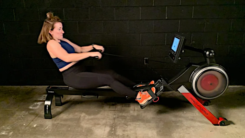Our tester using the ProForm Pro R10 rowing machine.