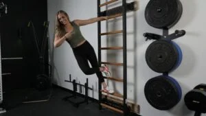 woman on benchk wall bars