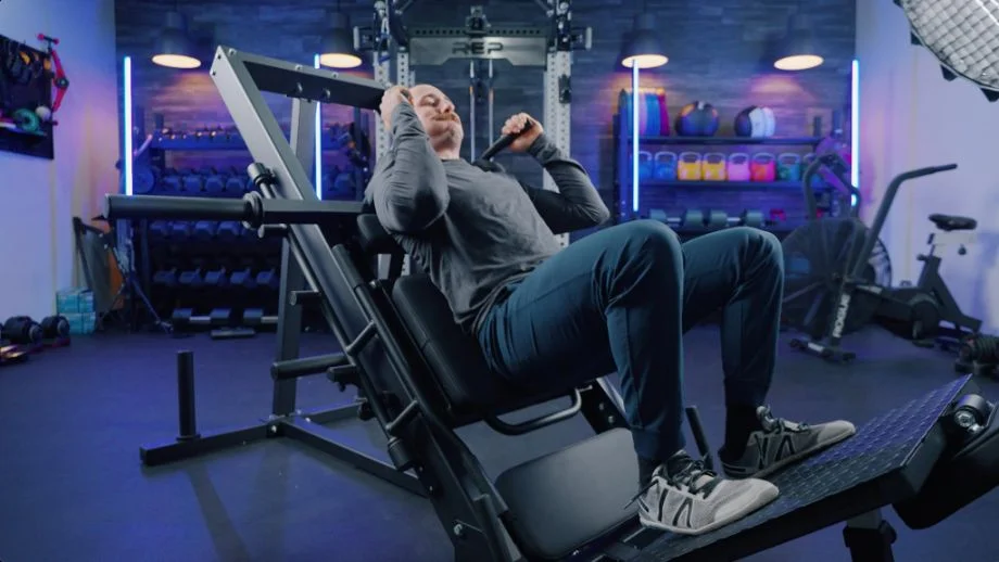 Coop performing hack squats on the Titan Leg Press Hack Squat Machine