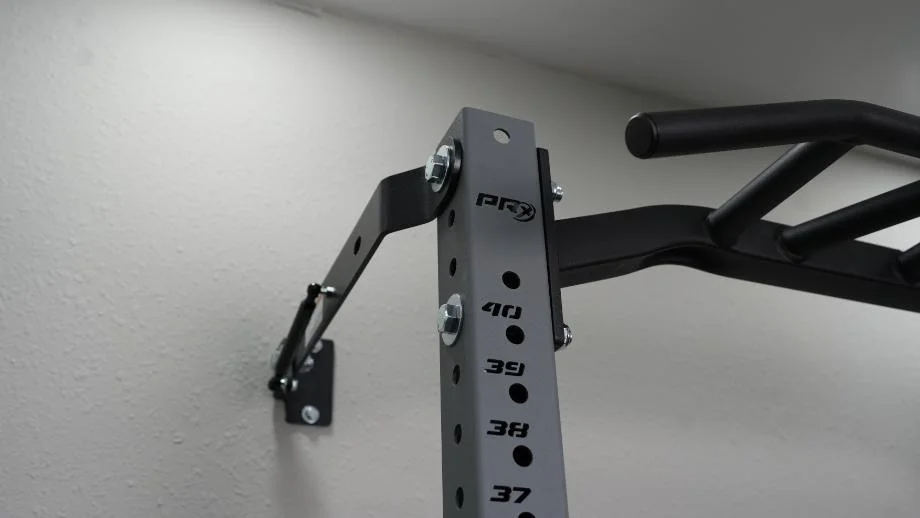 A closer look at the connection of the PRx Profile PRO Squat Rack mounted onto the wall