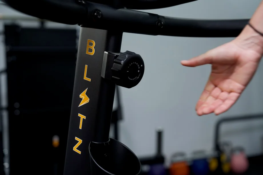 Someone about to grab the adjustment knob of the Bells of Steel Blitz Stepper