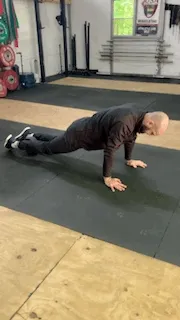 Knee Tuck Using Ab Roller