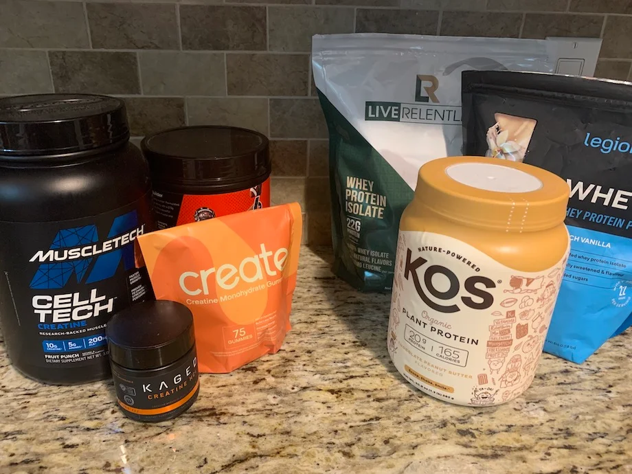 An image of creatine vs protein supplements on a counter