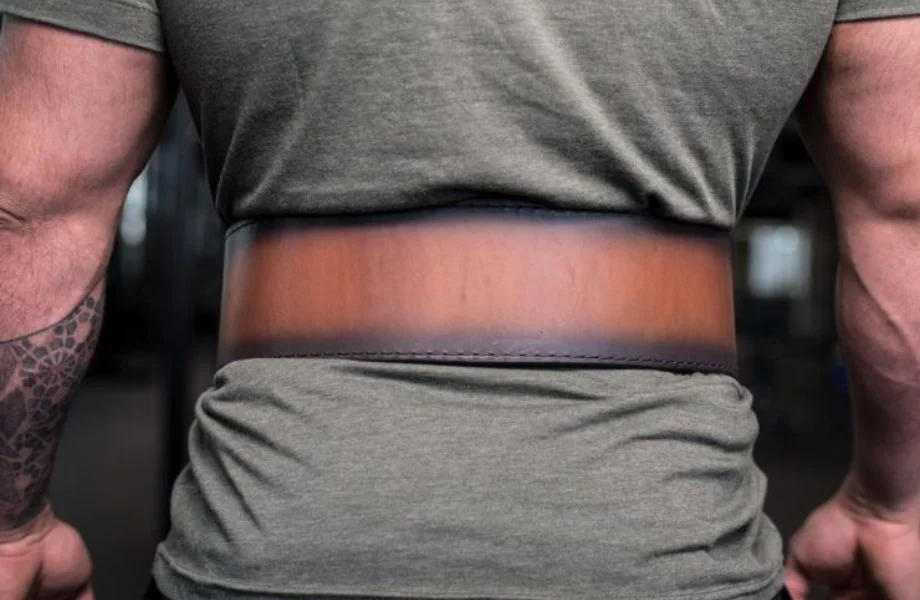 A photo of a person wearing the Rogue Faded 4" Lifting Belt as seen from the back
