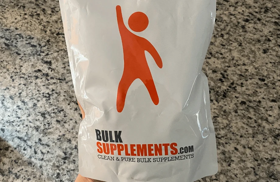 Our tester holding a bag of Bulk Supplements Organic Beet Root Powder