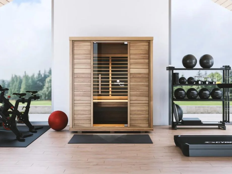 A Sunlighten Amplify II Sauna is shown in a gym setting