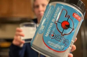 woman holding bang pre workout container