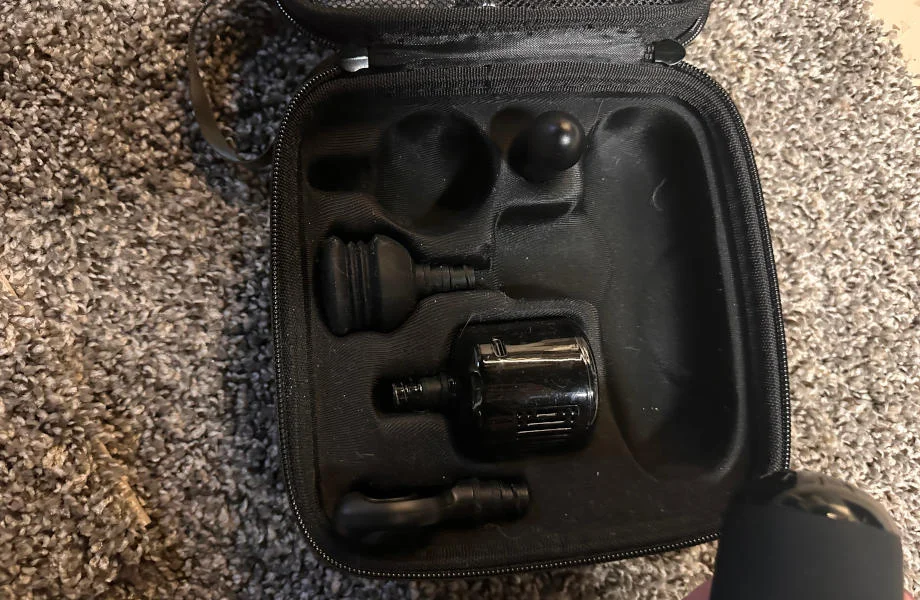 An opened case displays all of the attachments that come with the Bob & Brad Q2 Mini Pro massage gun.