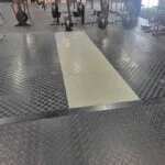 Looking at a gym with UESAKA Puzzle Platform flooring installed