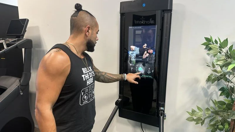 Our tester using the Tonal 2 Smart Home Gym.