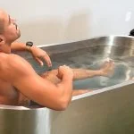 Our submerged tester braces against the icy water in a Polar Monkeys Cyber Tub