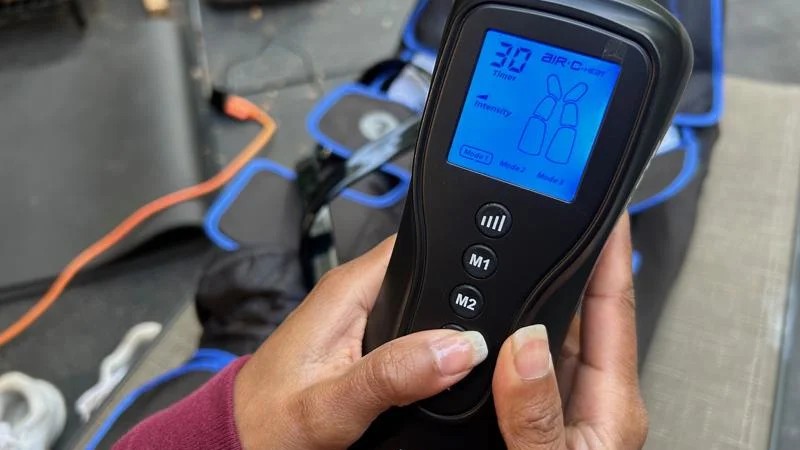 A close look at the controls for a pair of ReAthlete Air-C Leg Massager compression boots