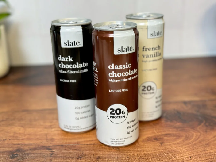 A side view of 3 Slate Protein Shakes.