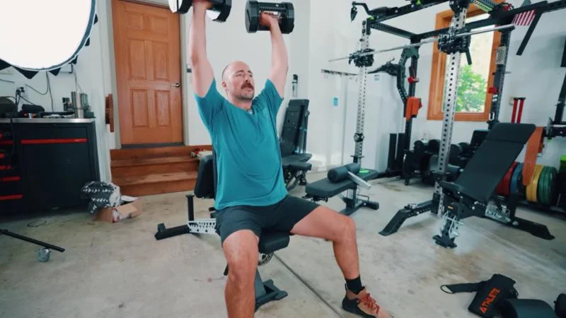 Coop performing seated presses on the Freak Athlete ABX Weight Bench