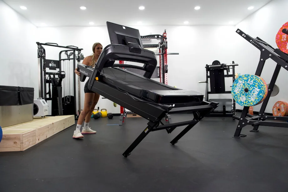 GGR Everything lead reviewer Lindsay Scheele moves the NordicTrack Commercial 2450 treadmill using the built-in wheels