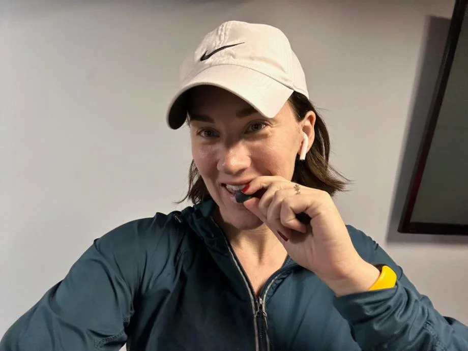 Our tester putting a Jacked Factory creatine gummy in her mouth