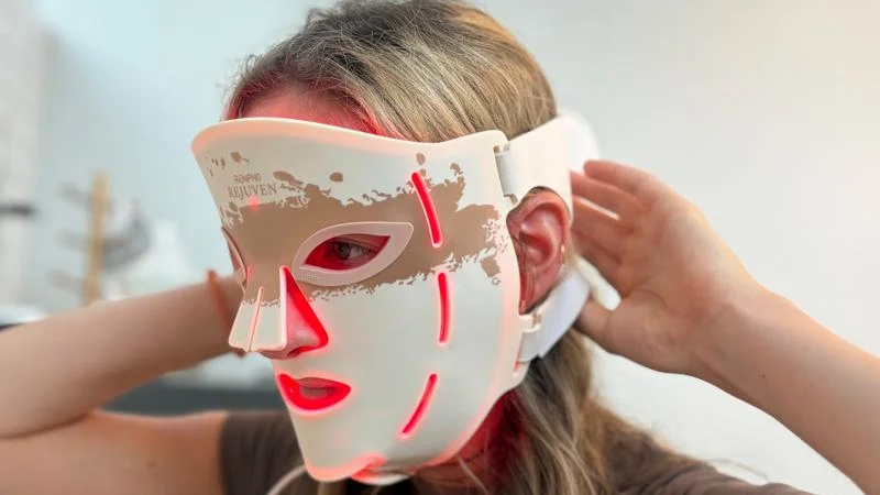 Putting on the Renpho LED Light Therapy Mask