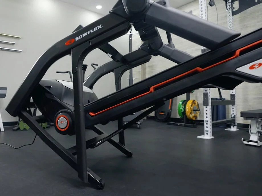 Product tester moving the Bowflex Treadmill 10 using the built-in transport wheels