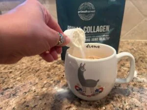 pouring primal harvest primal collagen into coffee
