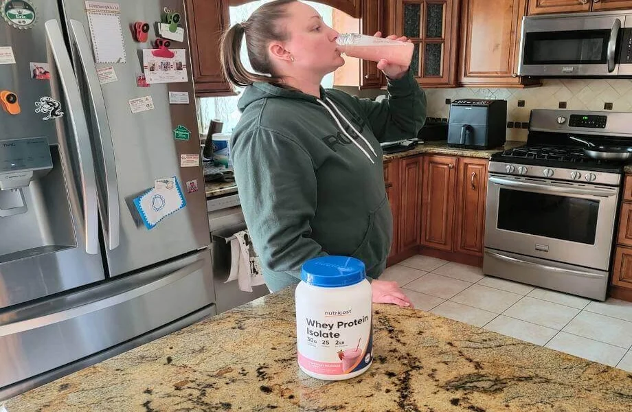 Our tester sipping on a full serving of Nutricost Whey Protein Isolate protein powder