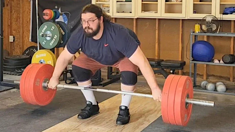 Olympian Caine Wilkes performs a snatch deadlift
